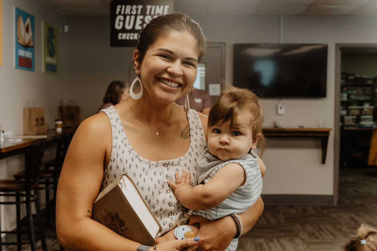 A mother and baby at the First Time Guest check-in at Belvedere.