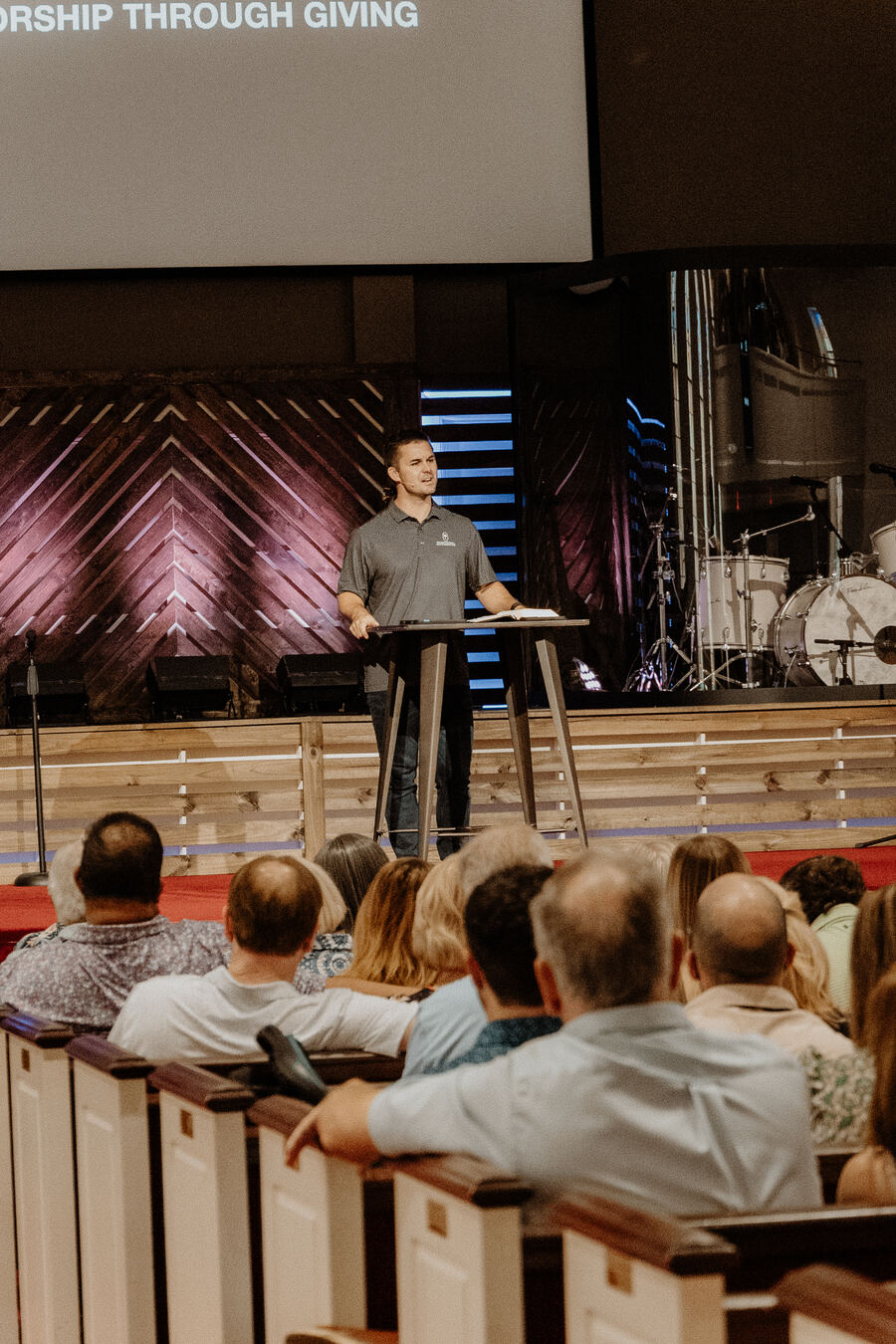 Teaching from an open Bible at Belvedere.
