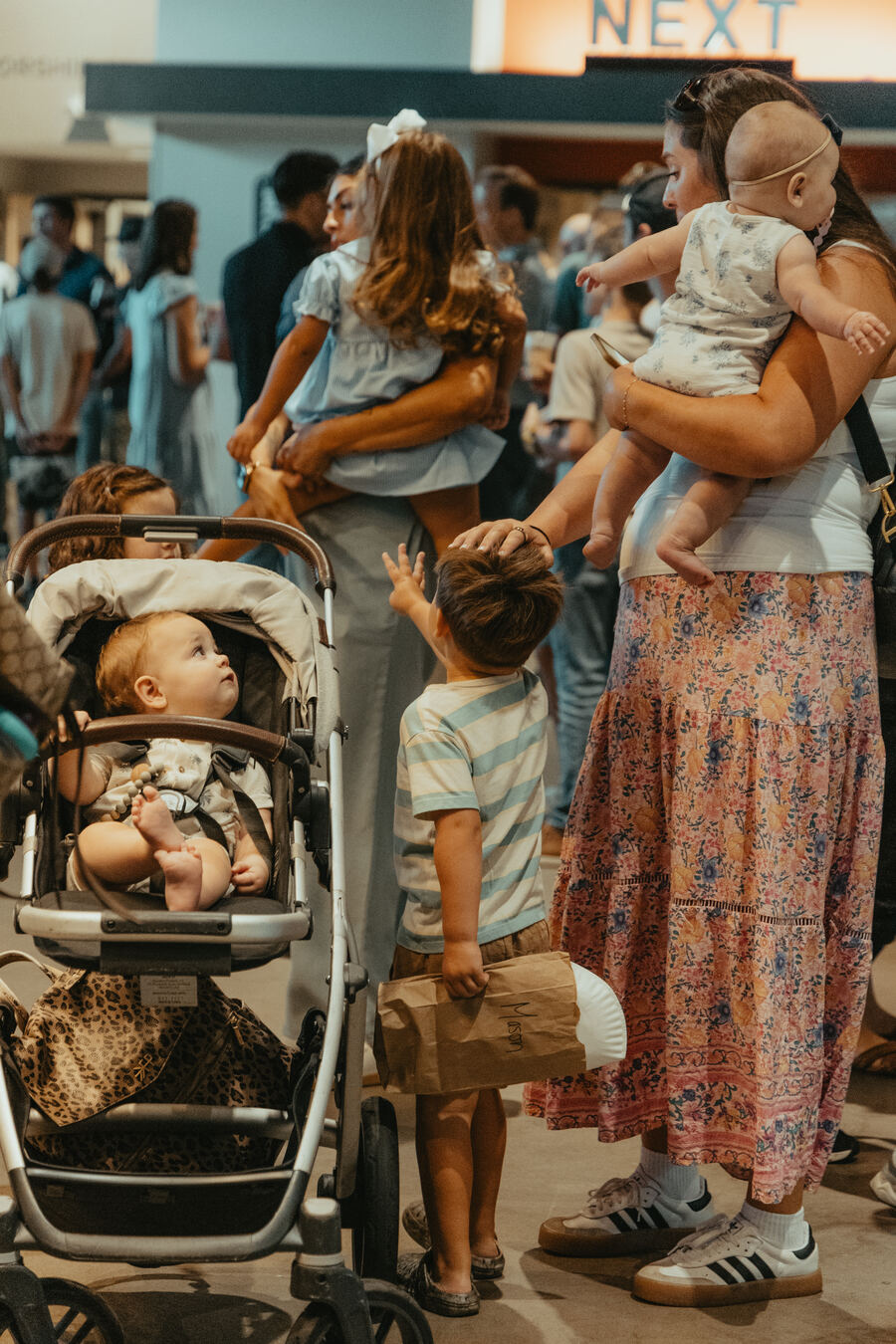 A mother and her children in the lobby.