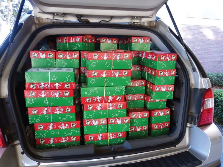 A car full of Operation Christmas Child shoeboxes.
