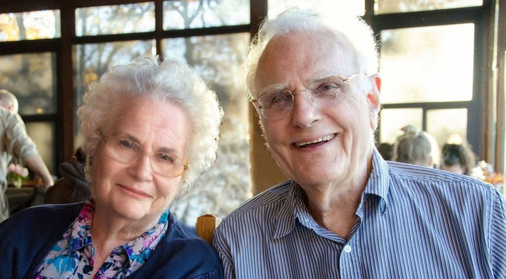 A senior couple smiling together.