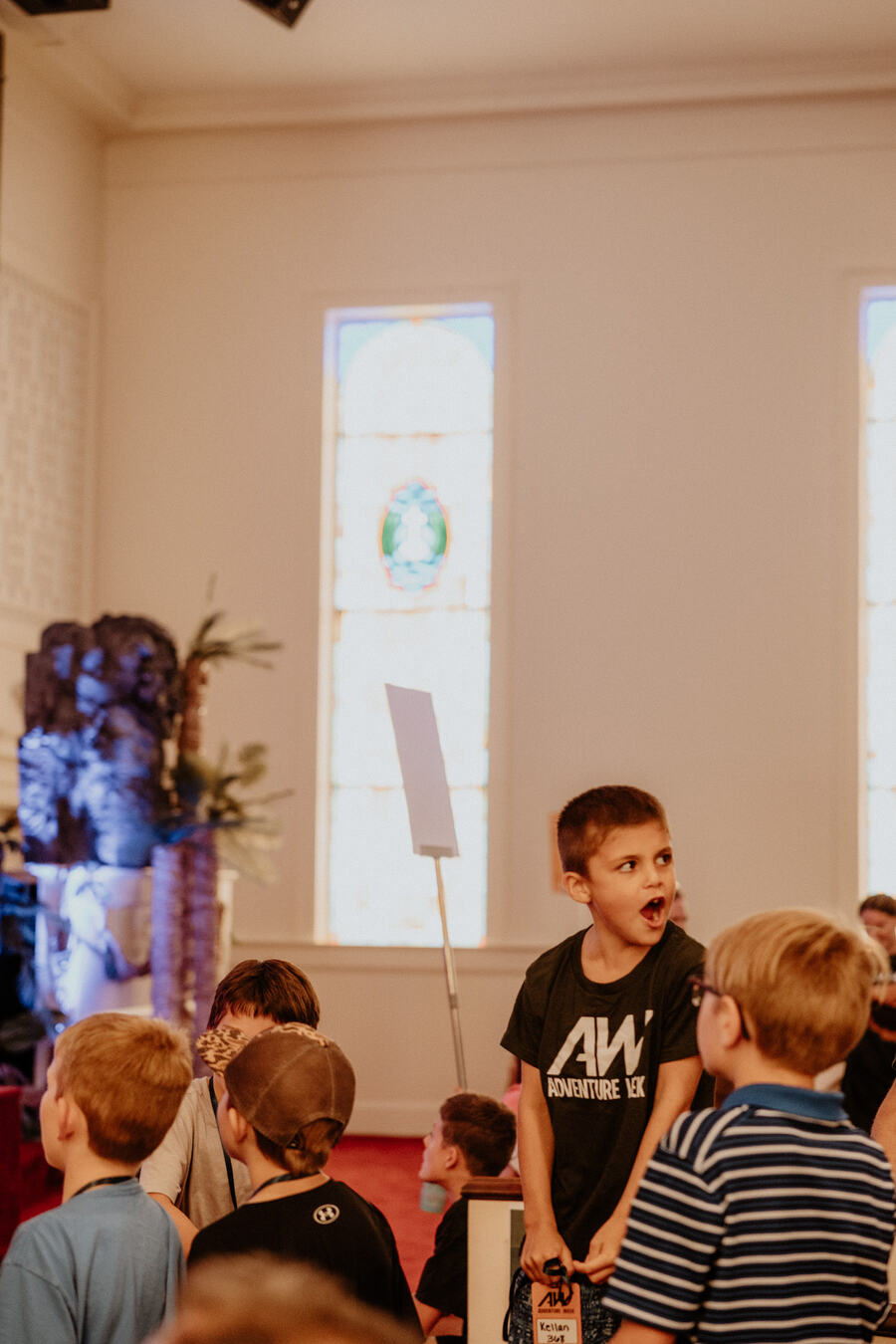 Children watching the front of the room.