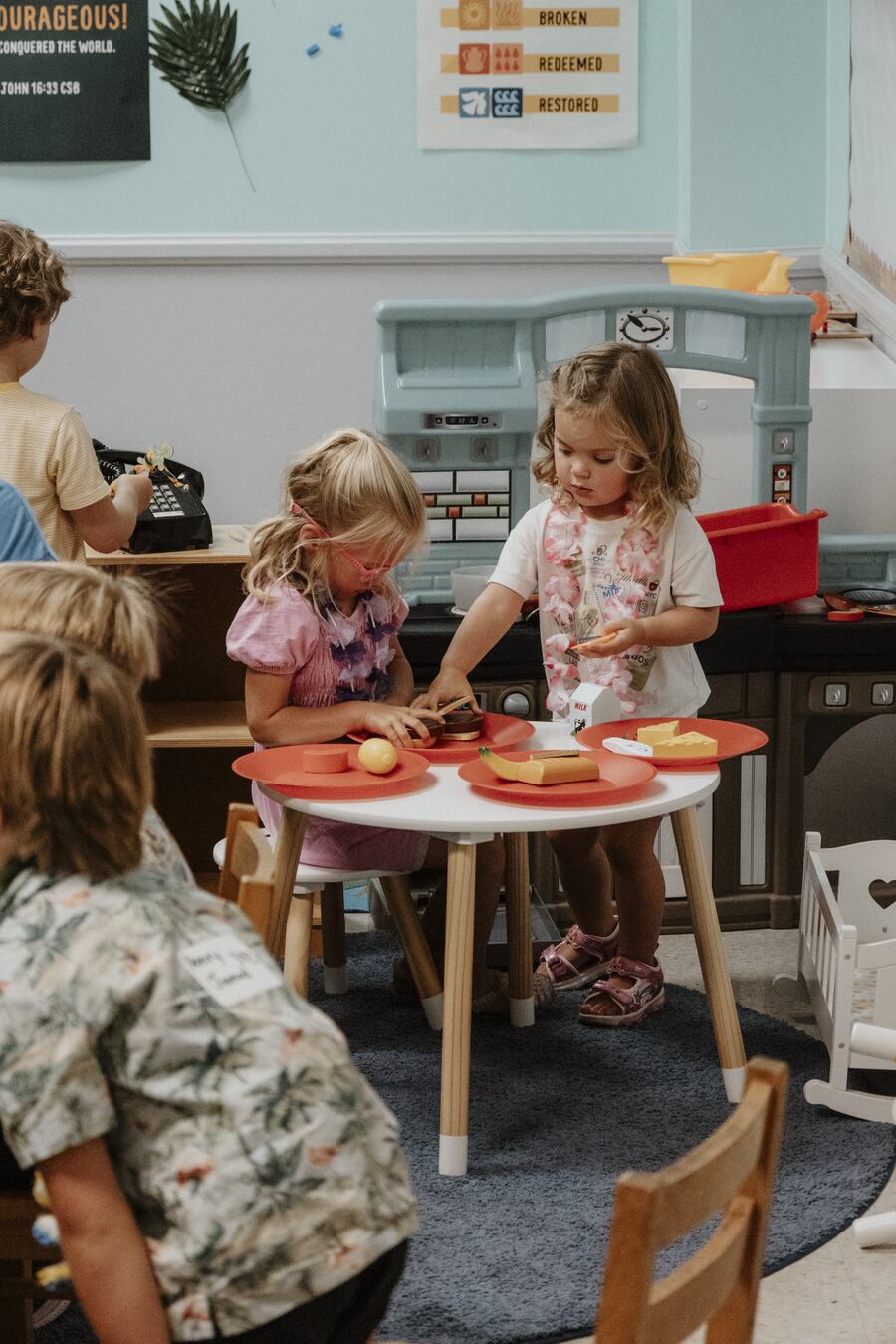 Children and a leader at the craft table.