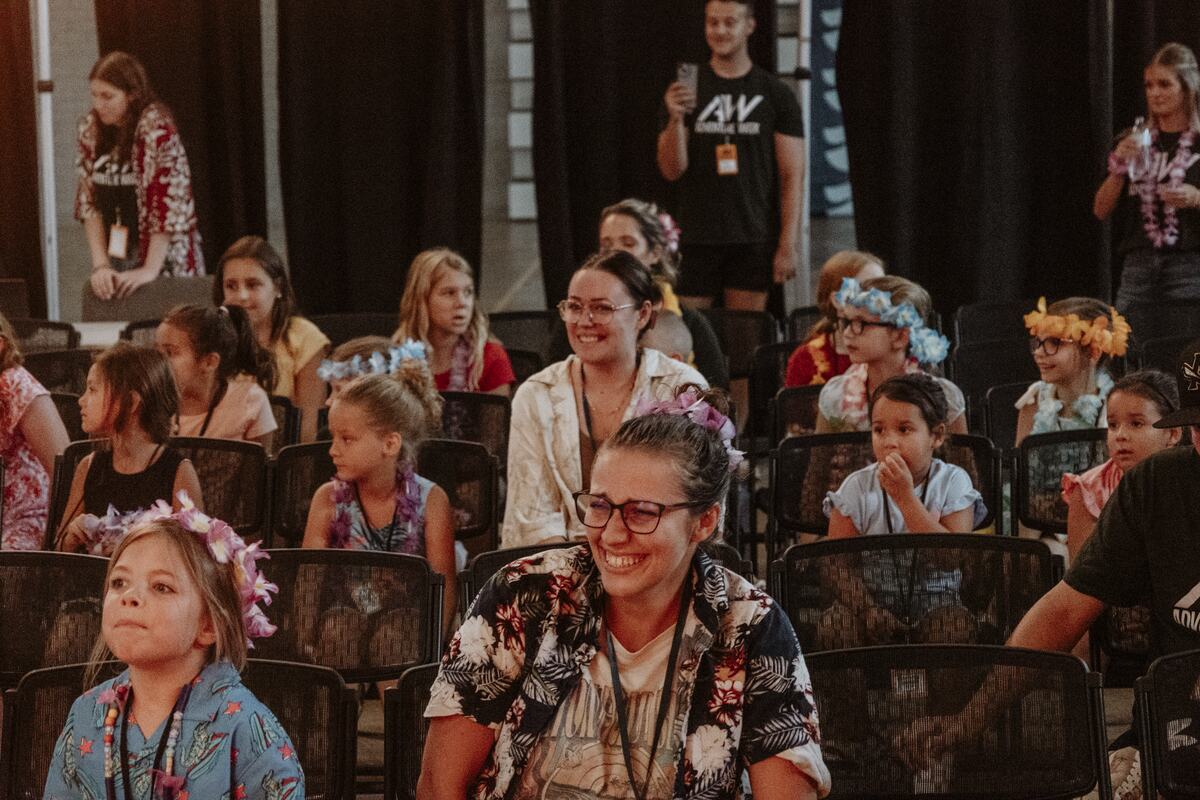 Children seated at the front of the room.