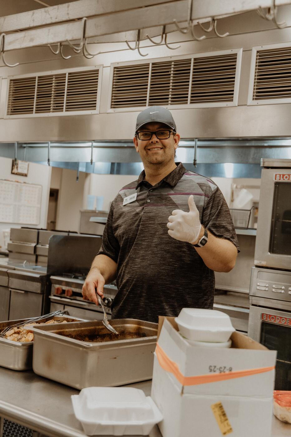 Serving from behind the counter.