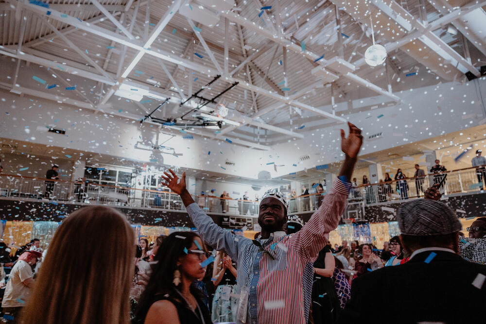 The room with hands in the air.