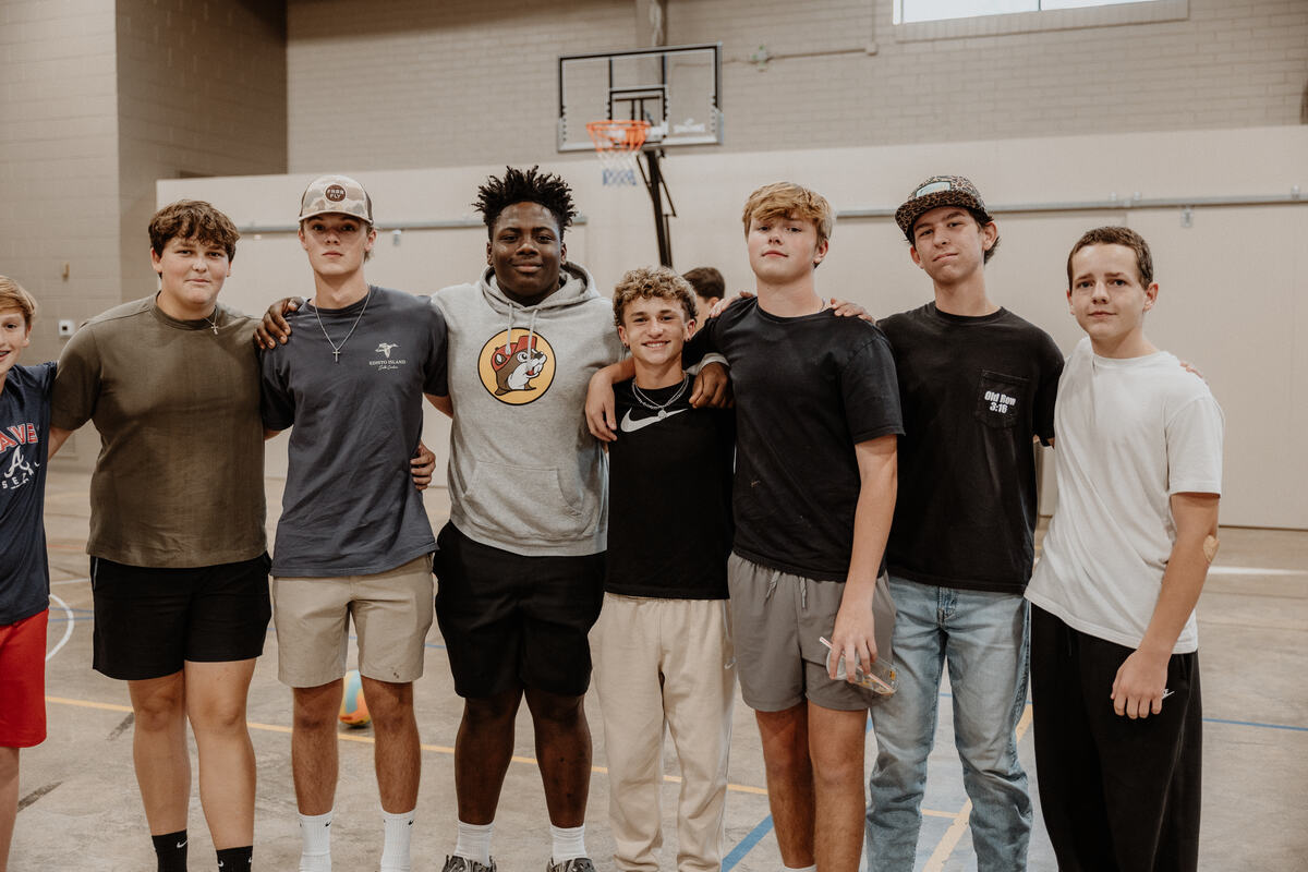 A group of students together in the gym.