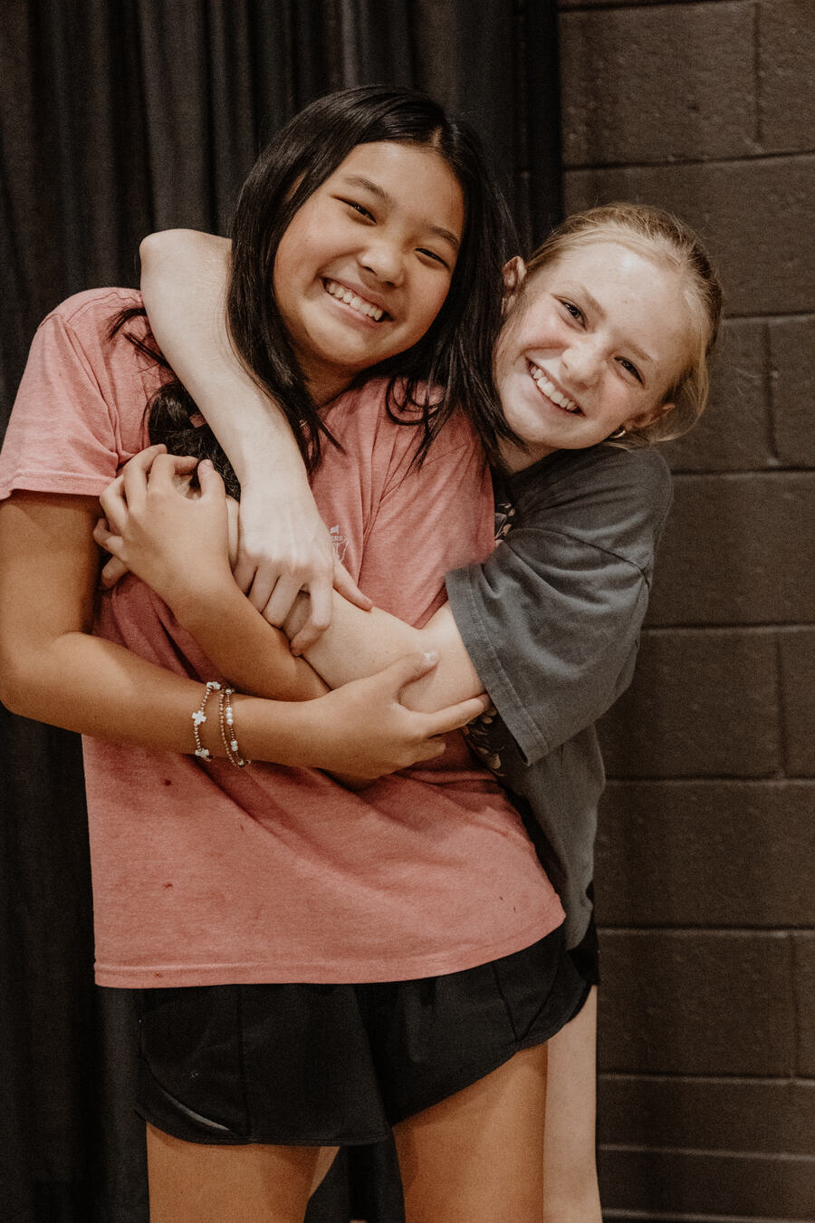 Two friends laughing together.