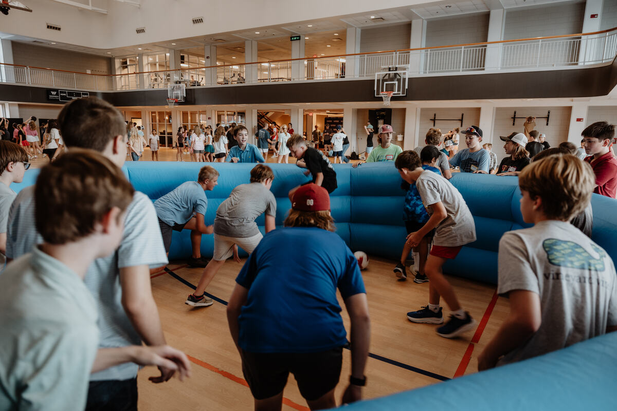 A game on the inflatable in the gym.