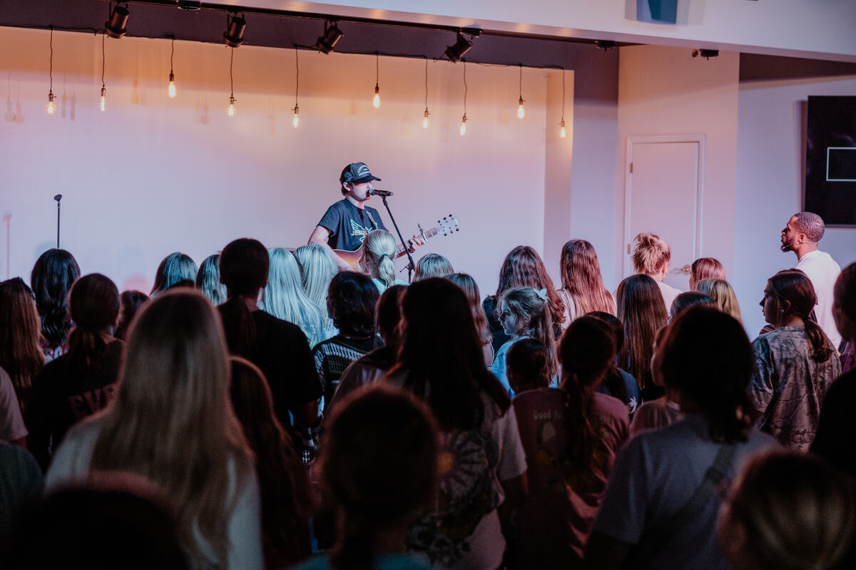 A room of students facing the stage.