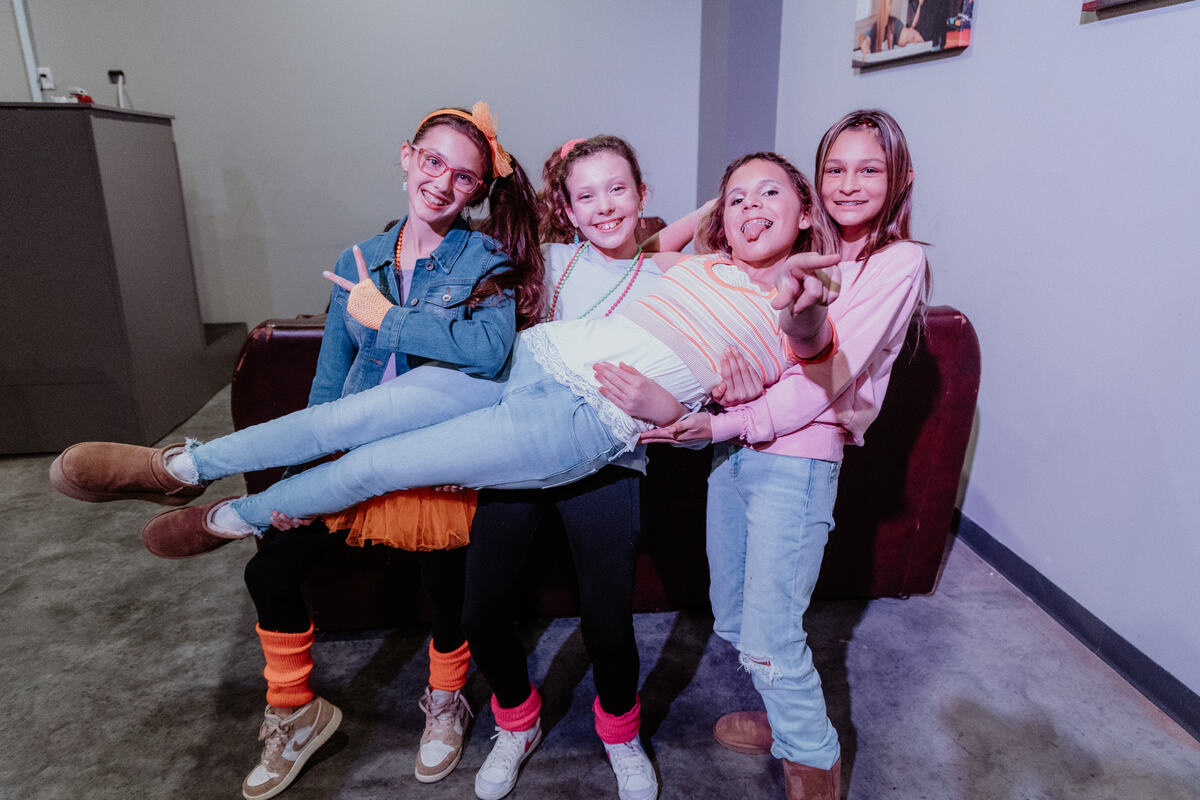 Students piled on the couch, laughing.
