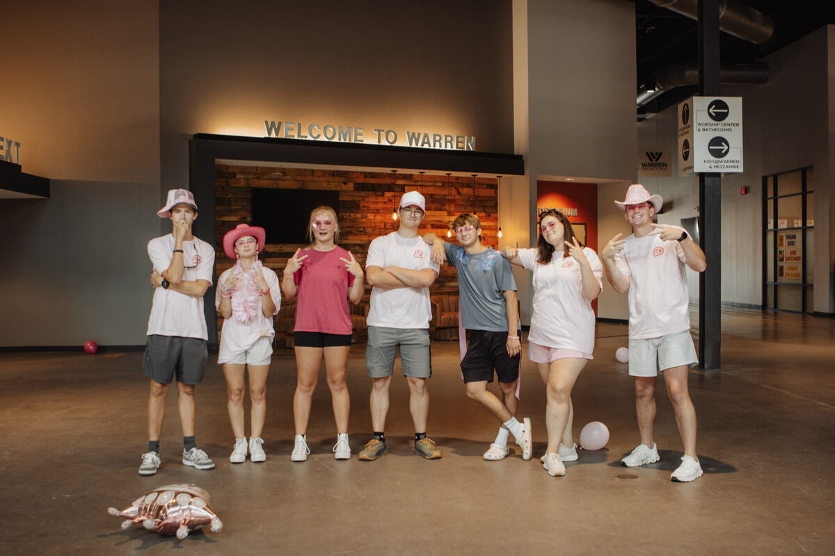 A group of students together in the lobby.