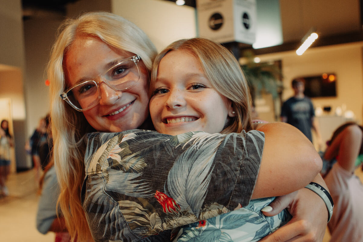 Two students hugging.