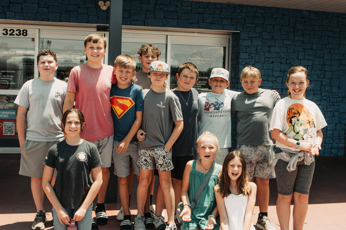 Middle school students together outside the building.