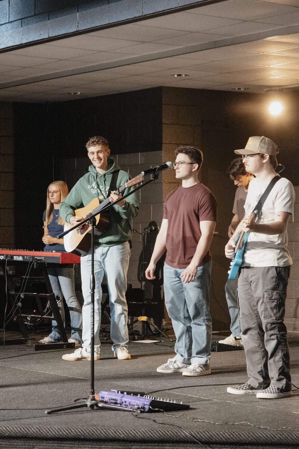The band leading worship on stage.