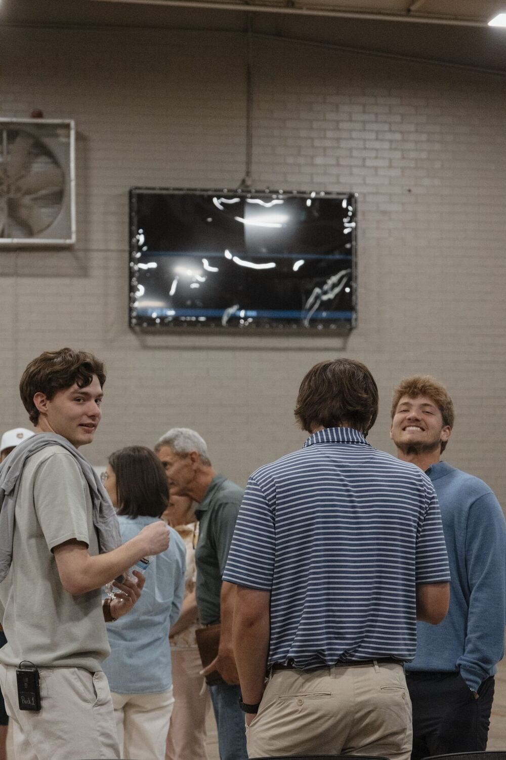 A group standing and talking after the night.
